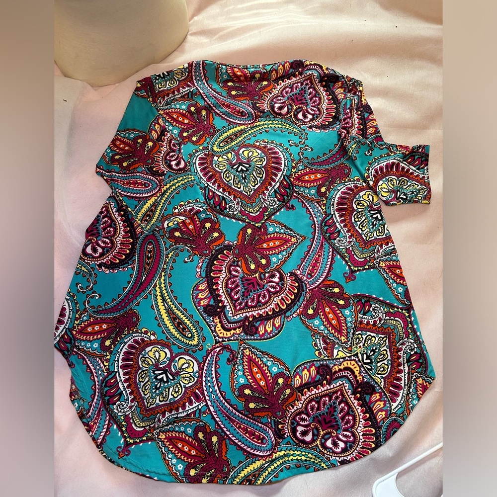 Local boutique stretchy top. Beautiful on. Tunic length. 3/4 sleeves.
